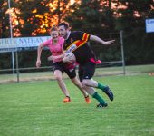Man playing tag Rugby cork